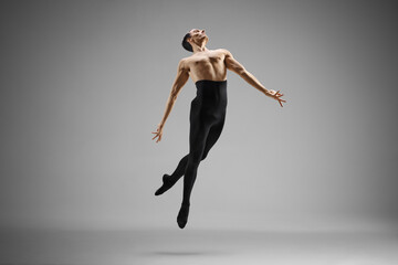 Male ballet dancer performing a jump