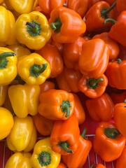 red and yellow peppers at the farmers market
