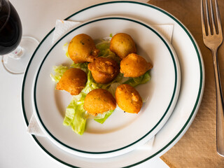 Cod fritters. Bunoles de bacalao. Spanish cuisine