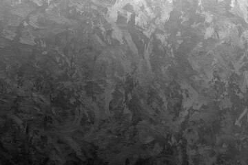 Black wall covered with decorative Venetian plaster, frontal view