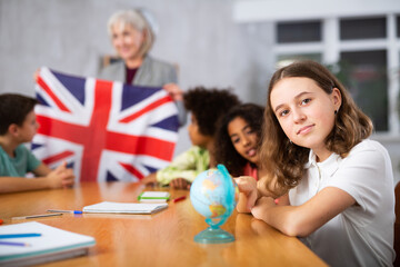 Kids learning together about united kingdom in geography class