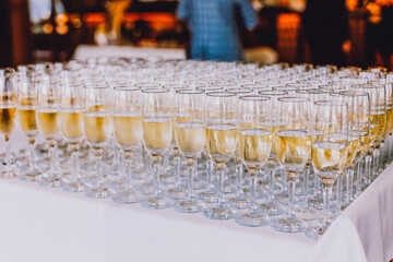 Glass of champagne on the table, Champagne for a toast, welcoming guests, alcohol at the wedding,...