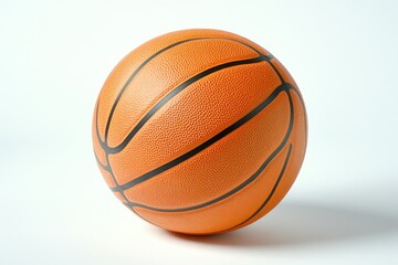 Fototapeta premium A close-up shot of a basketball ball on a white surface, ideal for sports-themed designs or marketing materials