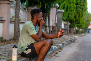 young african man using mobile phone