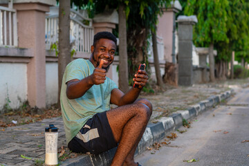 young african man using mobile phone