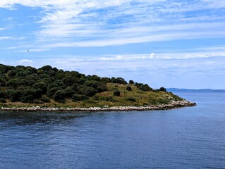 Fototapeta premium Coastline of the island of Corfu in Greece on a sunny summer day, summer holiday at the Mediterranean Sea 