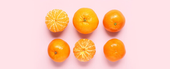 Sweet mandarins on pink background