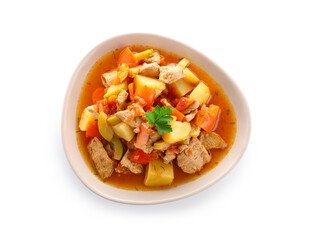 Bowl with delicious beef stew and parsley on white background