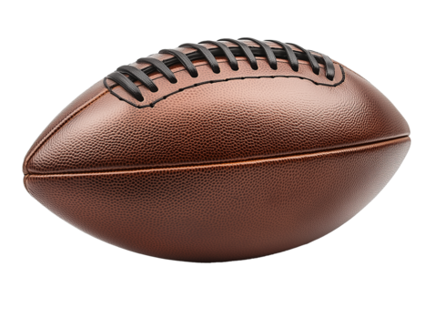 A detailed view of a classic brown leather rugby ball resting on a flat surface in a sports setting ready for play