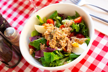 Plate of salad with tuna, eggs and cherry tomatoes