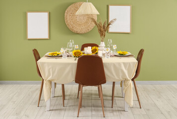 Table setting with sunflowers in dining room