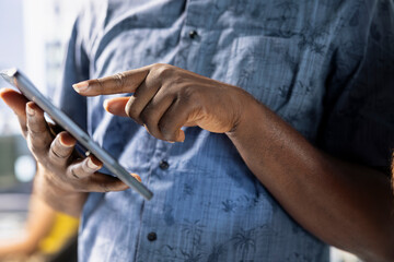 Engineer doing software quality assurance, checking source code on tablet. Close up of IT...