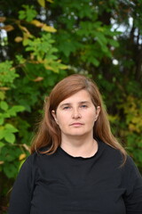 portrait of a woman against the backdrop of nature,