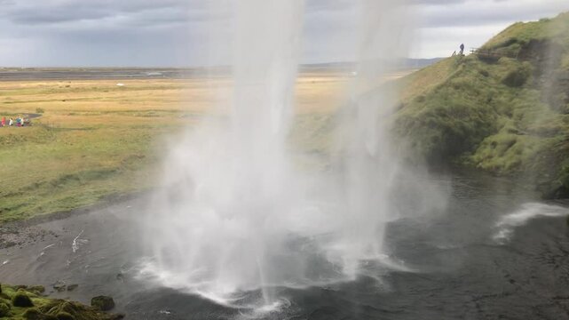 view behind waterfall