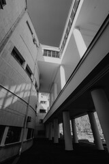 Modern architecture, black and white photography. Geometric lines and shadows create a striking contrast. Abstract architectural design, building detail, urban landscape. Perfect for design, interior 