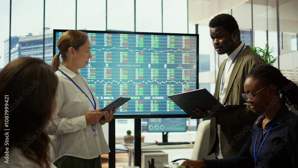 Poster business associates sharing ideas in a corporate briefing meeting, utilizing interactive boards to p