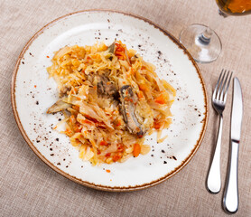 Stewed white cabbage with pork ribs, carrots and bay leaf