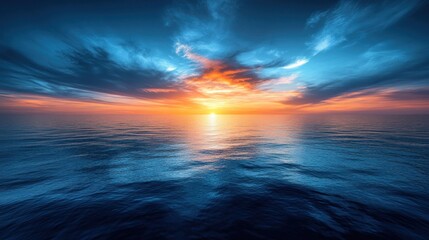 Obraz premium Vivid sunset over calm ocean.