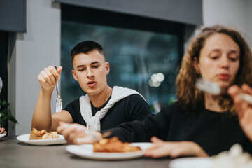 A group of high school students gathered around a table, sharing a meal and engaging in conversation, fostering friendship and connection.