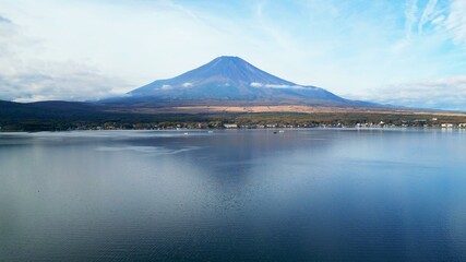 Fototapeta premium Drone aerial shot of Lake Kawaguchi and Mt. Fuji