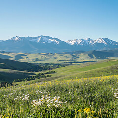 Fototapeta premium Majestic Mountain Landscape with Lush Green Fields and Wildflowers Under Clear Blue Sky, Capturing the Serenity of Nature's Beauty in a Picturesque Setting