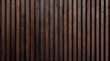 Naklejka premium A close-up view of a wooden wall with vertical slats in dark brown tones.