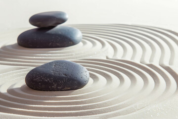 zen garden meditation stone background with stones and lines in sand for relaxation balance and harmony spirituality or spa wellness