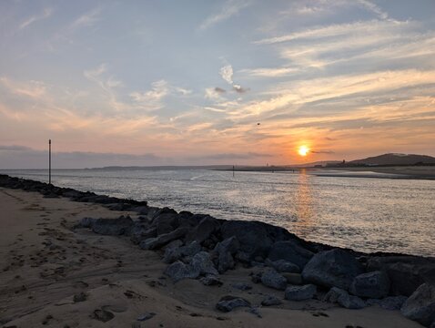 A sunset view of swansea bay and the mumbles from the Neath estuary