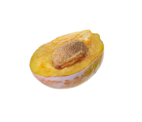 Half of ripe plum isolated on white