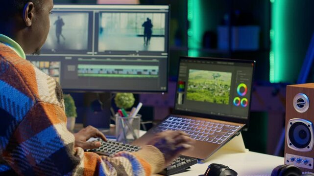 Videography specialist editing new movie clip for video montage, working on freelance contract for post production agency. Creative designer adjusting contrast using toolbar panels. Camera A.