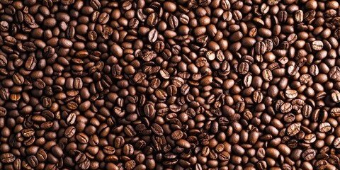 Fototapeta premium Heart-shaped background of roasted coffee beans