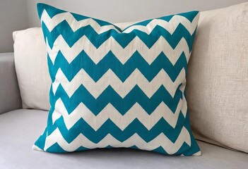 A close-up of a handmade cushion cover with a chevron pattern