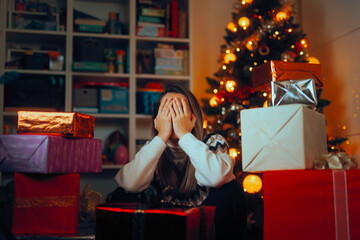 Upset Stressed woman Surrounded by Wrapped Christmas Gifts. Disappointed lady feeling overwhelmed...