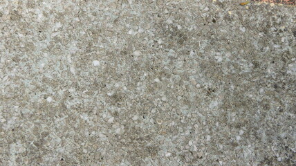 Detailed Texture of Weathered Concrete Surface with Embedded Aggregates