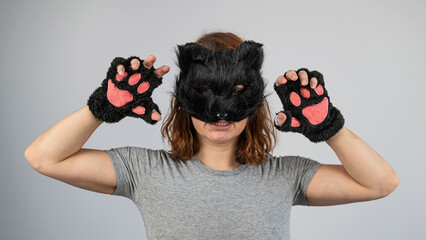 Portrait of a woman in a cat costume on a white background. Quadrober. 