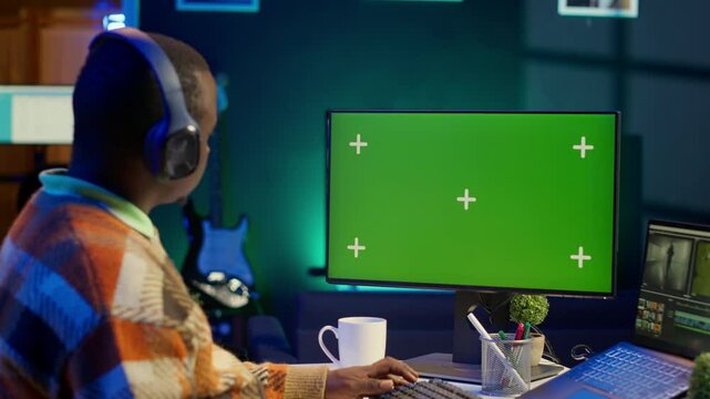 Video maker editing montage clips on coloring software next to mockup, working on color correction and motion graphics to edit footage. Content creator editing clips on toolbar panels. Camera A.