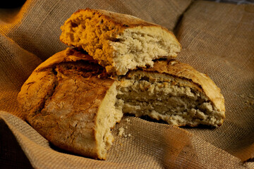 Homemade bread, freshly baked and cut for consumption.
