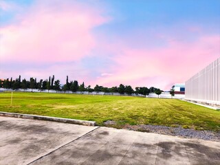 colorful pink sunset in a football field