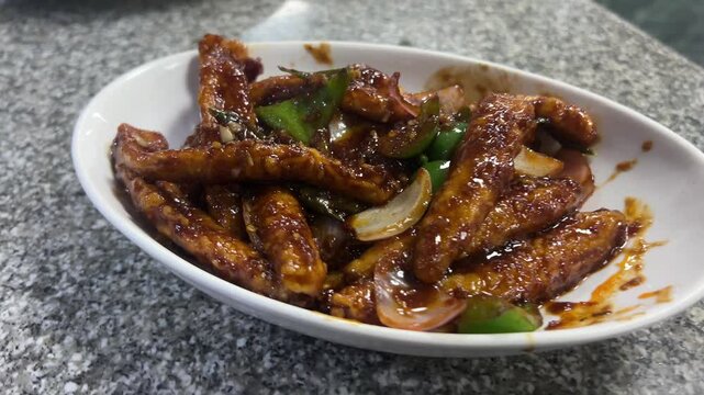 Crispy chilli baby corn served in a restaurant in Kolkata