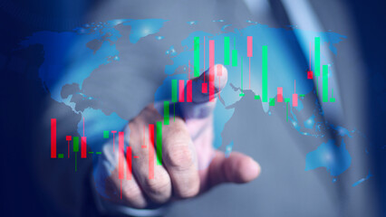 Businessman touching graph with his finger on screen with world map background. Futuristic technology. Business success strategy concept.