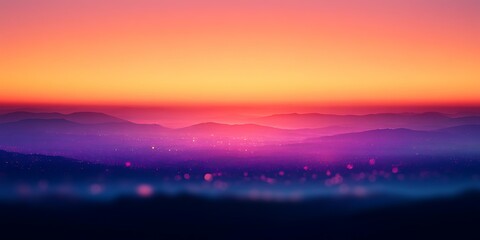 Fototapeta premium Blurred sunset over hazy mountains.