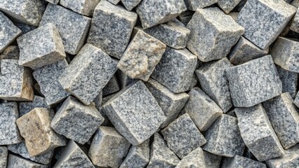 Closeup of retro style grey granite stones with chaotic diagonals creating background texture, granite, stones