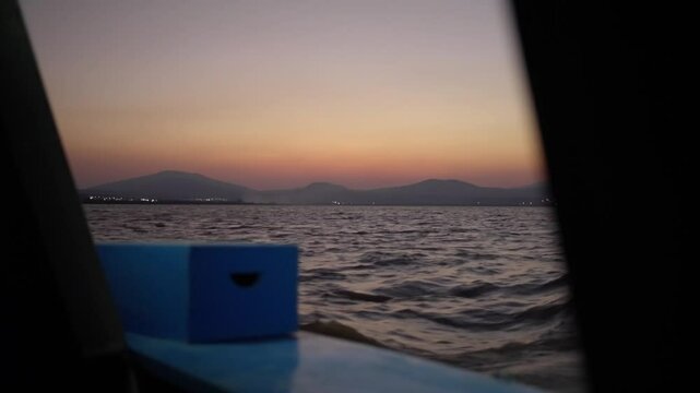 SLOW MOTION SHOT OF PATZCUARO LAKE WATER VIEW FROM A BOAT