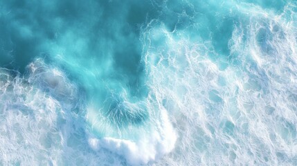 Fototapeta premium Top view of blue sea with mesmerizing surface waves on the beach