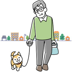 笑顔で犬の散歩をするシニア男性