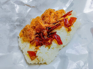 Thai food is "khao niew moo tod", Sticky rice and deep fried pork.