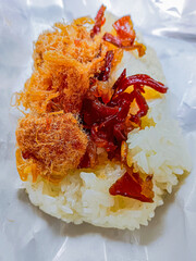 Thai food is "khao niew moo tod", Sticky rice and deep fried pork.