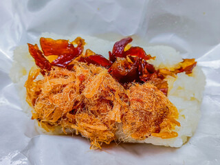 Thai food is "khao niew moo tod", Sticky rice and deep fried pork.