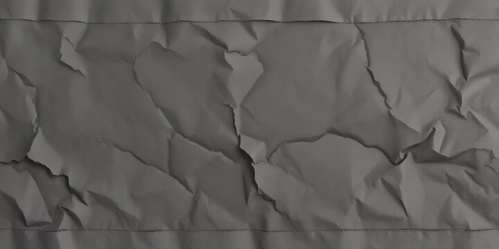 Textured gray fabric with intentional creases and folds adds depth to design