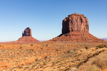 Fototapeta premium Monument Valley Rock Formations, Arizona-Utah Border, USA – Iconic Desert Landscapes with Majestic Buttes and Mesas, Captured in Stunning Light and Natural Splendor